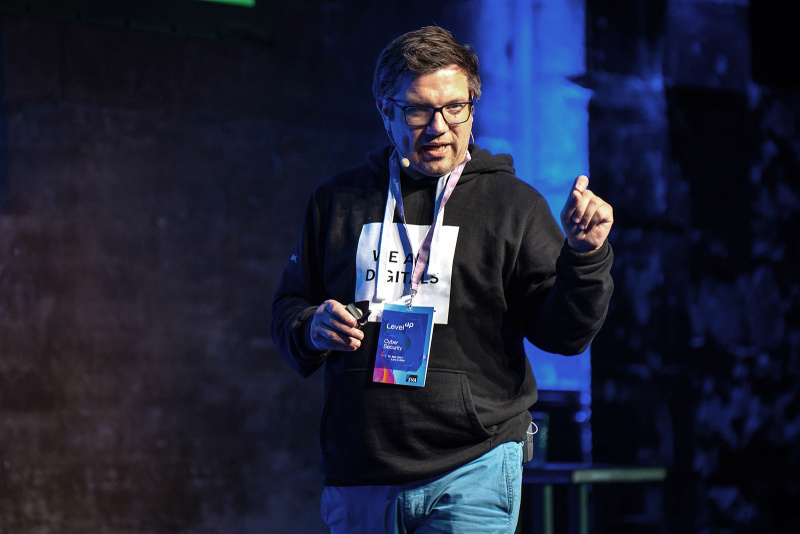 Speaker with a headset microphone on stage